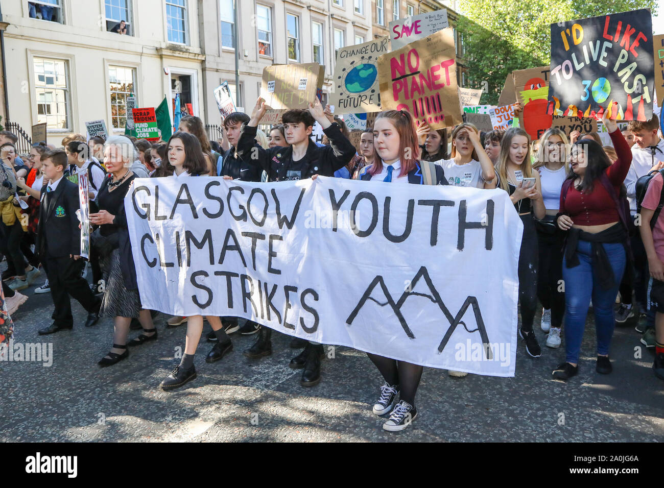 Glasgow, UK. 20 September 2019. Several thousand turned out to take part in the 'Scottish Youth Climate Strikers' march from Kelvingrove Park, through the city to an assembly in George Square to draw attention to the need for action against climate change. This parade was only one of a number  that were taking place across the United Kingdom as part of a coordinated day of action. Credit: Findlay / Alamy News. Stock Photo