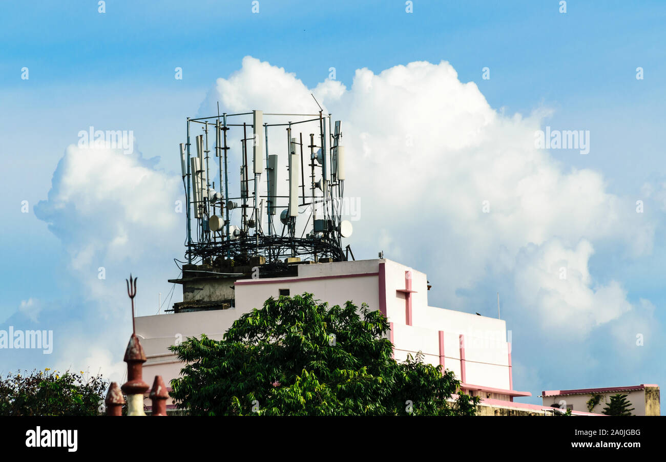 Heavy High Voltage Electric Power Transmission Cell Tower radio Antenna. Broadcast Steel beam tower cellular antenna. Industrial energy power design. Stock Photo