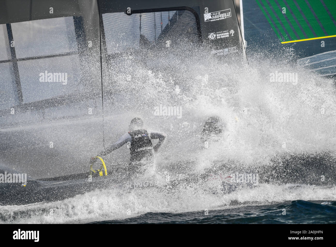 Australia SailGP Team skippered by Tom Slingsby catching a wave on the Rade de Marseille. Race Day 1. The final SailGP event of Season 1 in Marseille, France. Stock Photo