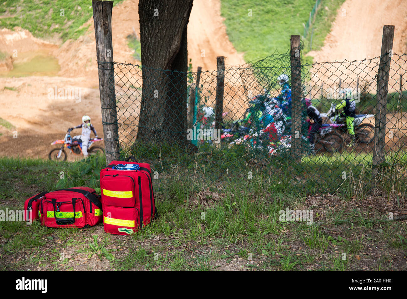 Giavera del Montello, Italy. 14 September 2019. Paramedics bags laying next to a tree with motorcyclists in the background. Credit: Lukasz Obermann/Alamy Live News Stock Photo