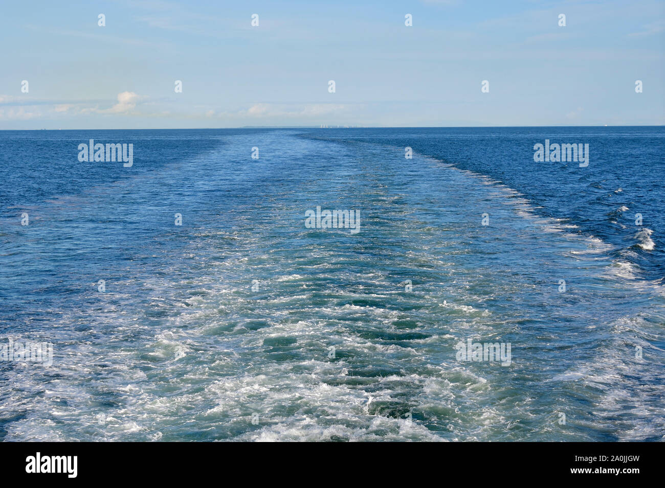 A horizontal image looking out the rear of a ferry boat leaving Vancouver British Columbia Canada. Stock Photo