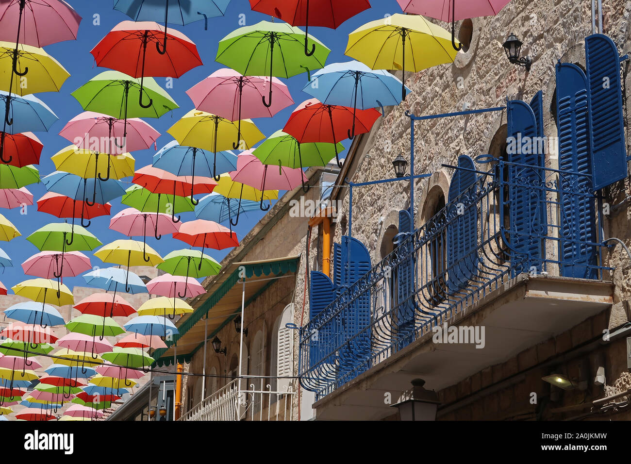 Colorful umbrellas are suspended above Nahalat Shiva alley a pedestrian