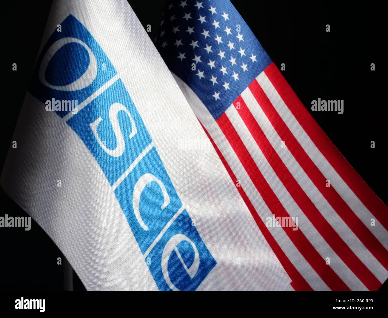 OSCE and USA flags. Cooperation and negotiation concept. Stock Photo