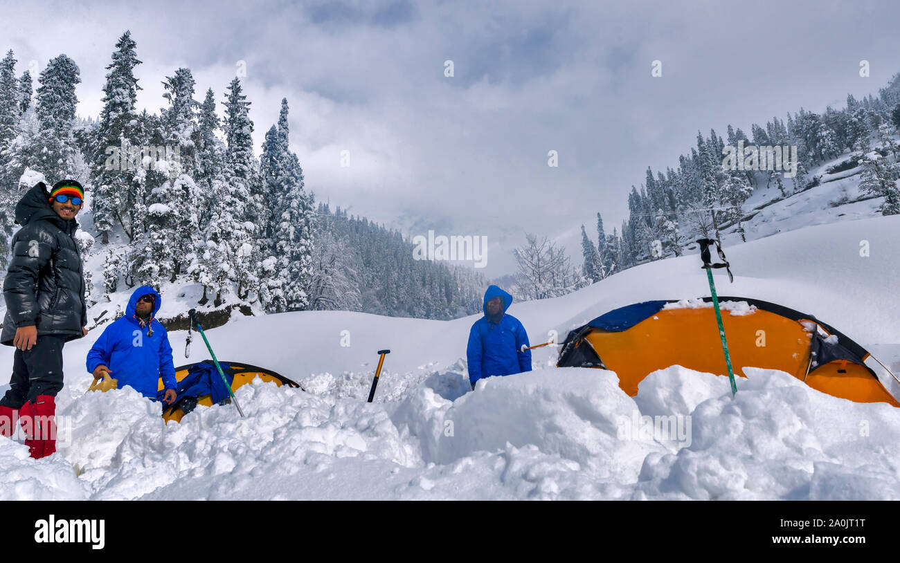 Mountaineers enjoying the nature after the snowfalls in winter. Stock Photo