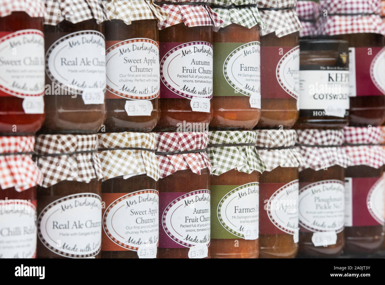 Jars of chutney in a shop window. Bourton on the Water, Cotswolds, Gloucestershire, England Stock Photo