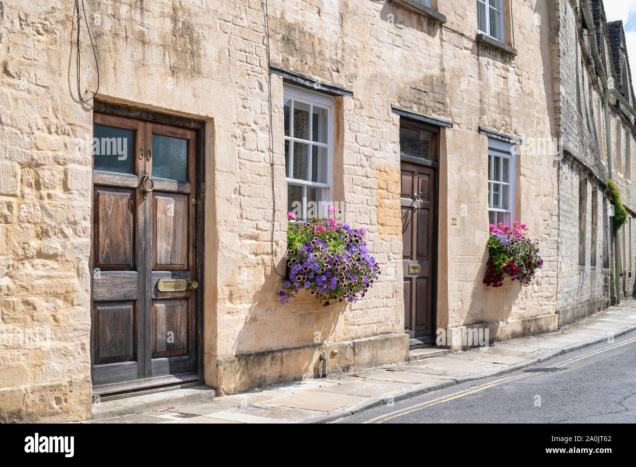 Floral window boxes outside cottages along coxwell street, Cirencester, Cotswolds, Gloucestershire, England Stock Photo