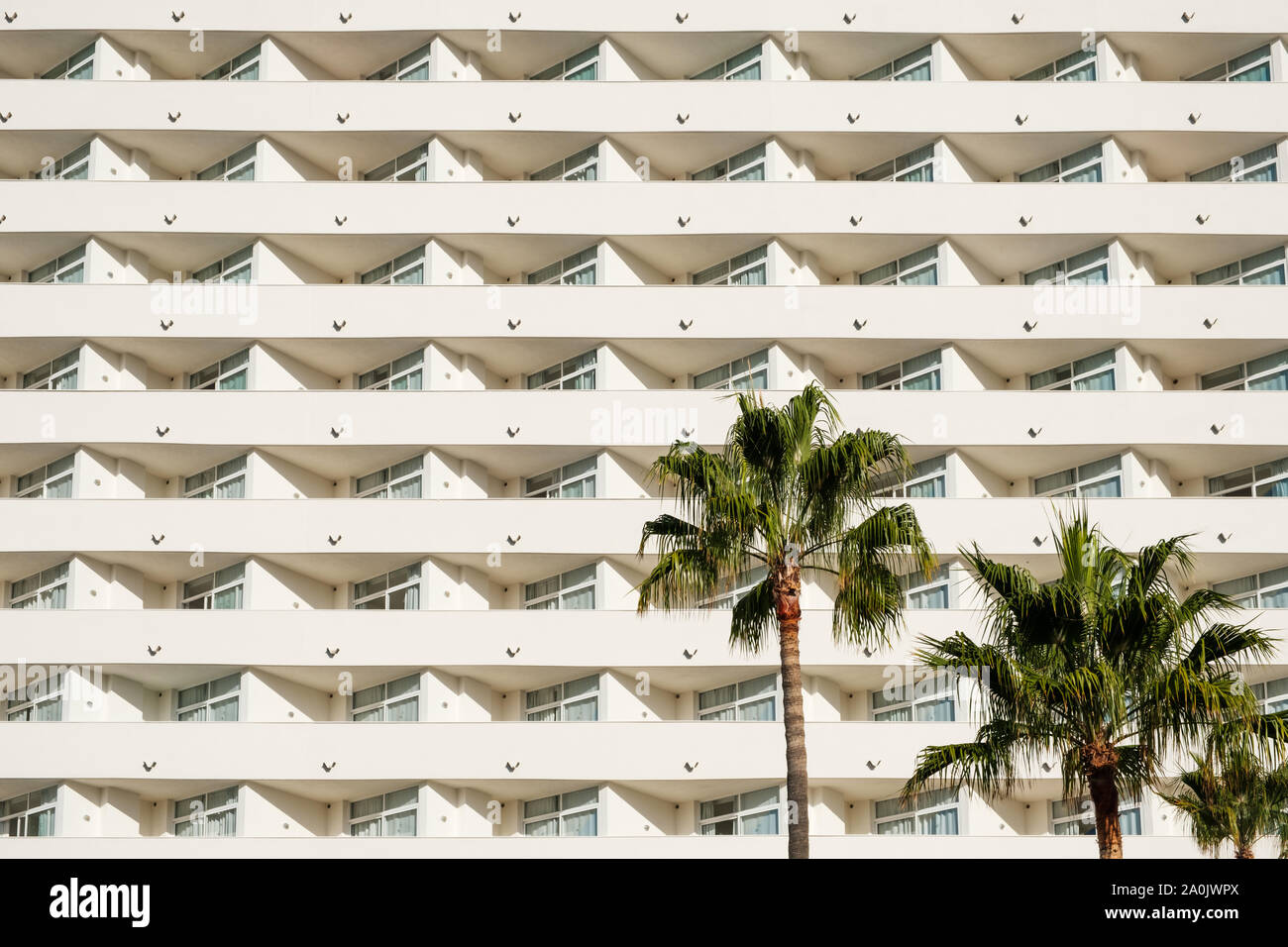 facade of a big hotel building with balconies Stock Photo