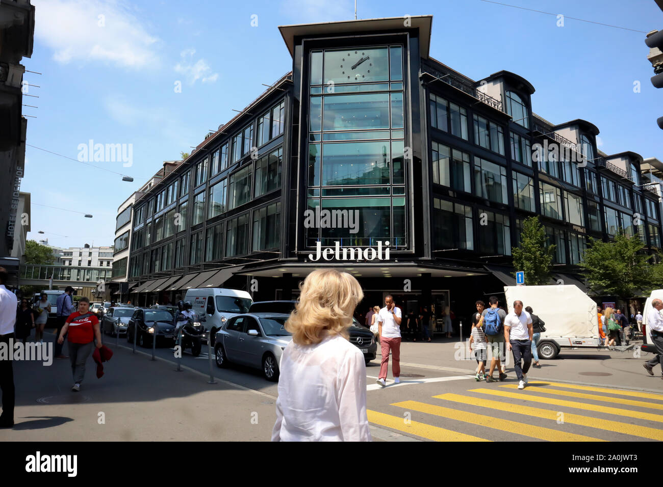 Zurich, Switzerland ,July 19, 2019: street with pedestrians in front of main entrance of Jelmoli building,  in Zurich. on sunny day. Stock Photo