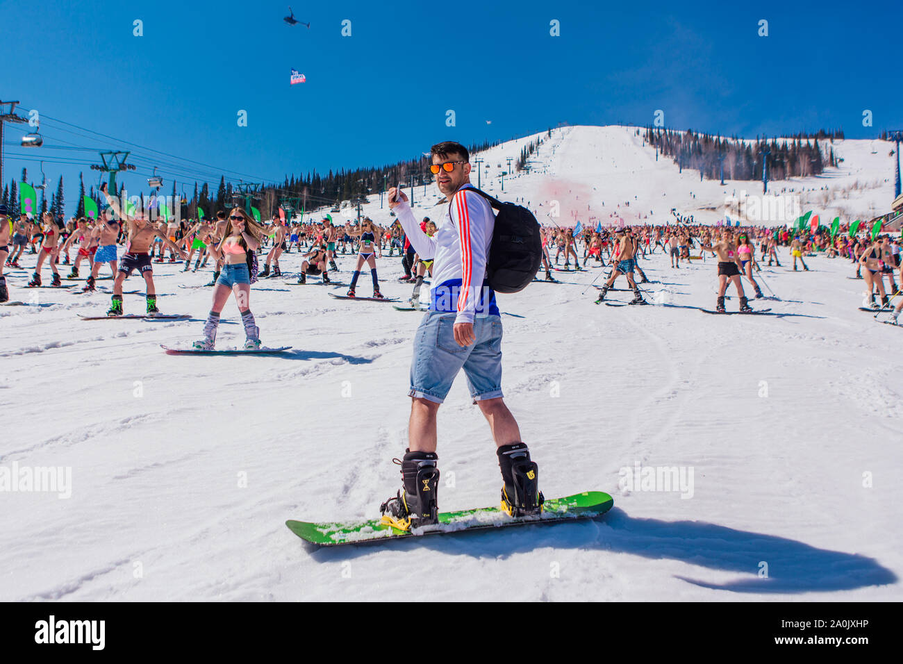 Sheregesh, Kemerovo region, Russia - April 13, 2019 : Crowd of people in  bikini and shorts riding snowboard and mountain ski on the slope Stock  Photo - Alamy