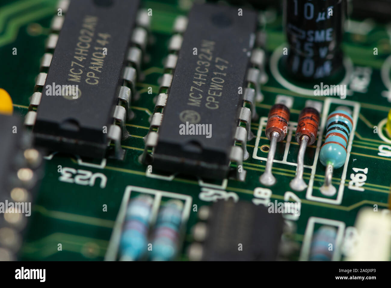 Close up shot of PCB unit with visible resistors, capacitors and micro procesors. Stock Photo