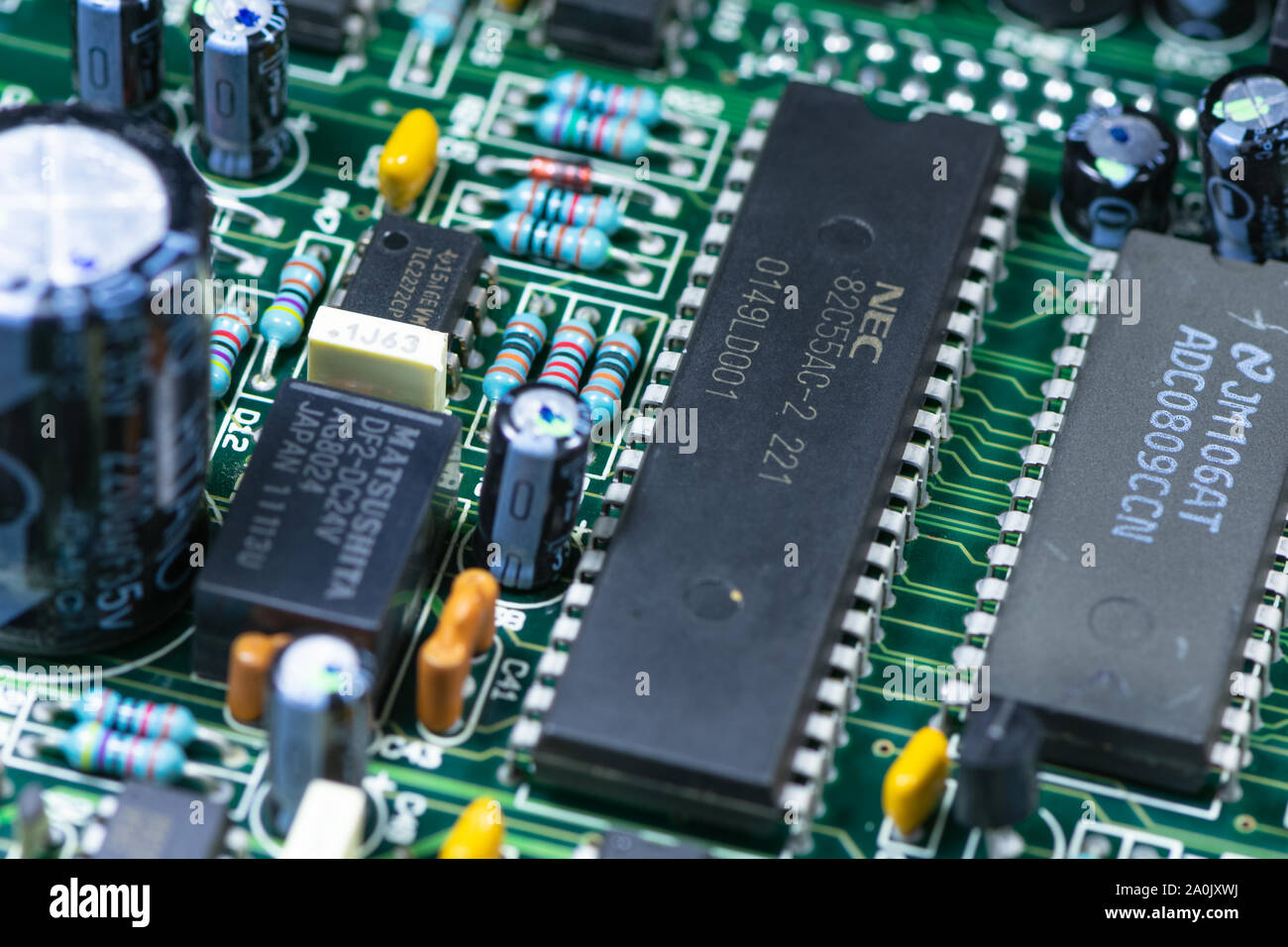 Close up shot of PCB unit with visible resistors, capacitors and micro procesors. Stock Photo