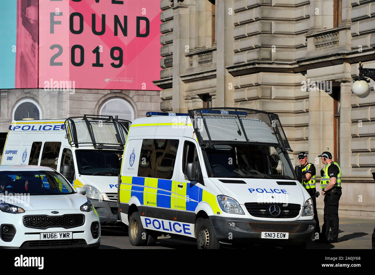 Glasgow, UK. 20 September 2019.  Scenes from a planned protest in George Square this afternoon after strikes started a year ago by 16-year-old Swedish schoolgirl named Greta Thunberg. Hundreds of chalk marked slogans littered the concrete of George Square with protestors from all ages and backgrounds. Credit: Colin Fisher/Alamy Live News Stock Photo