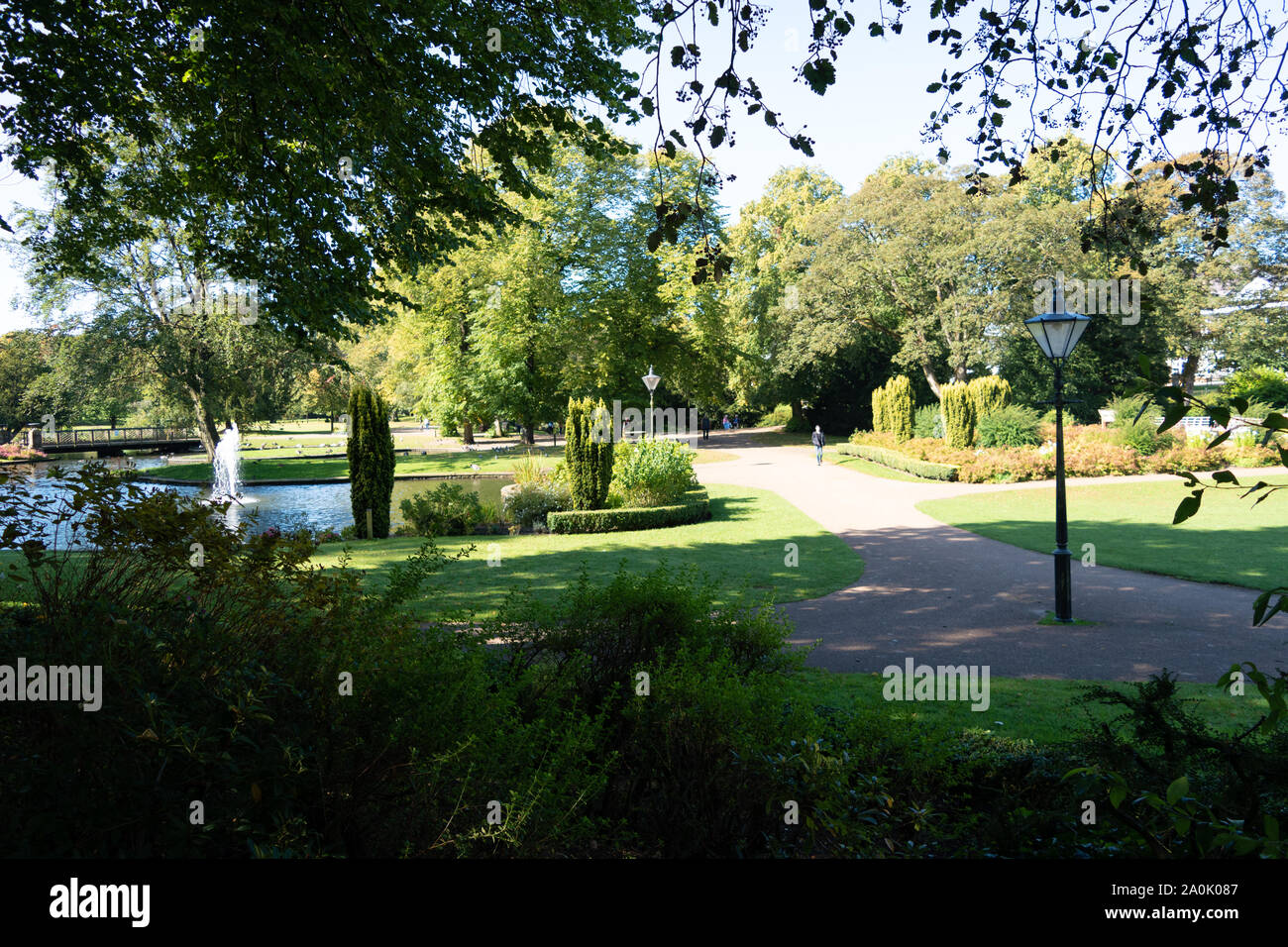 The Pavilion Gardens - a public park and popular outdoor space in the Peak District town of Buxton, Derbyshire on a sunny Autumn day. Stock Photo