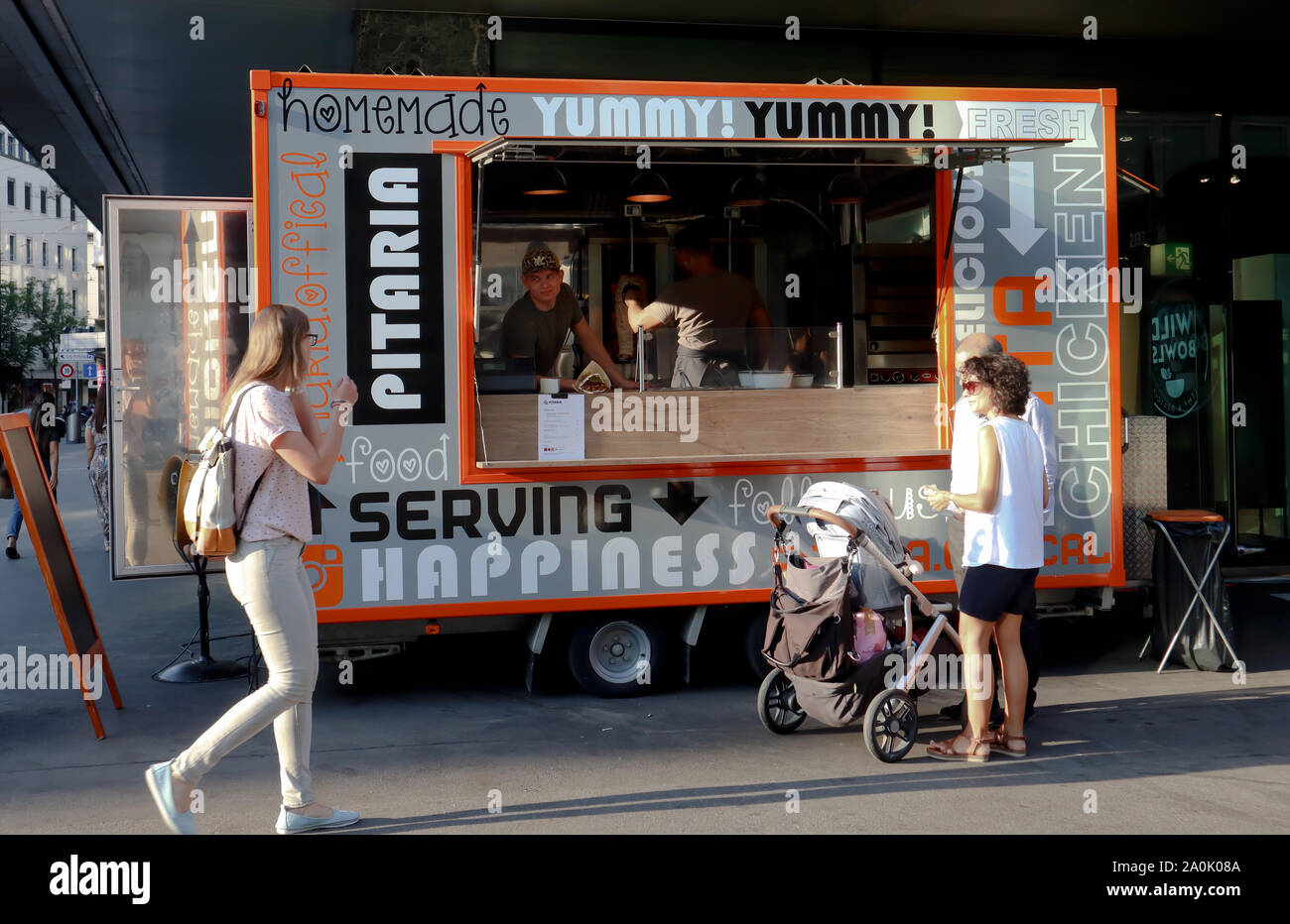 Zurich,Switzerland,July 19,2019seller in food truck selling food to a