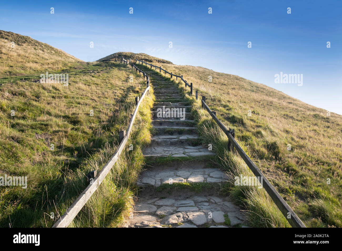 Stone steps leading up hill, journey concept of one step at a time Stock Photo