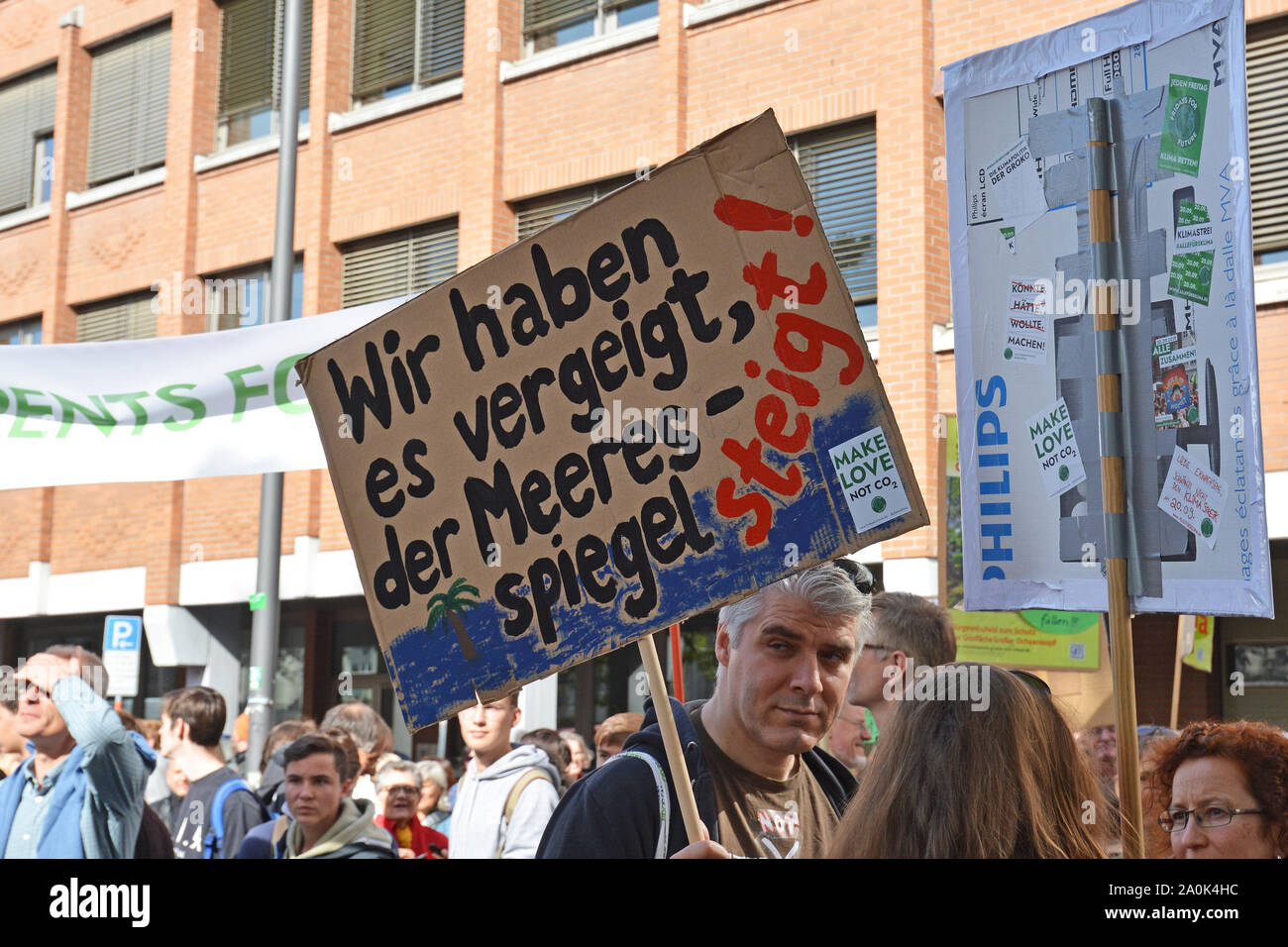Demonstration during Global Climate Strike with cardboard banner and German slogan saying 'We've blown it, the sea level is rising' Stock Photo