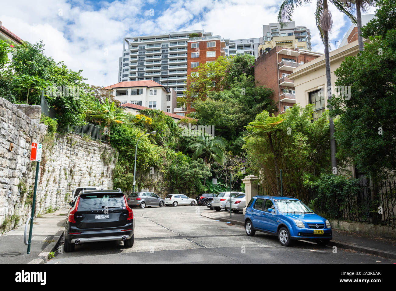 Sydney, Australia - March 10, 2017. Street view in Potts Point neighbourhood of Sydney, with cars, buildings and vegetation. Stock Photo