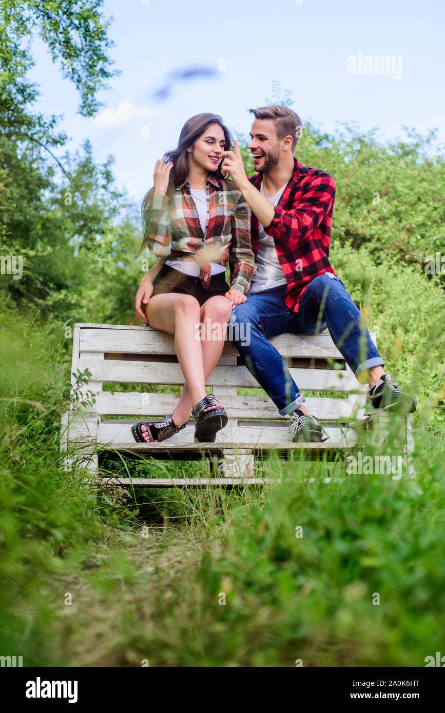 Couple in love sit on bench. Summer vacation. Enjoying nice