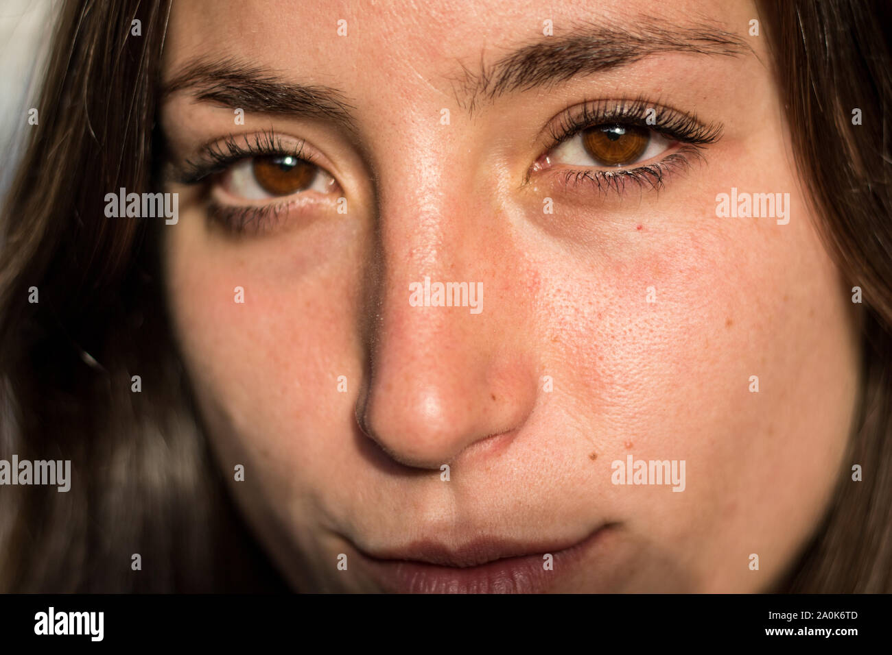 Beautiful brown eyes of a young girl Stock Photo