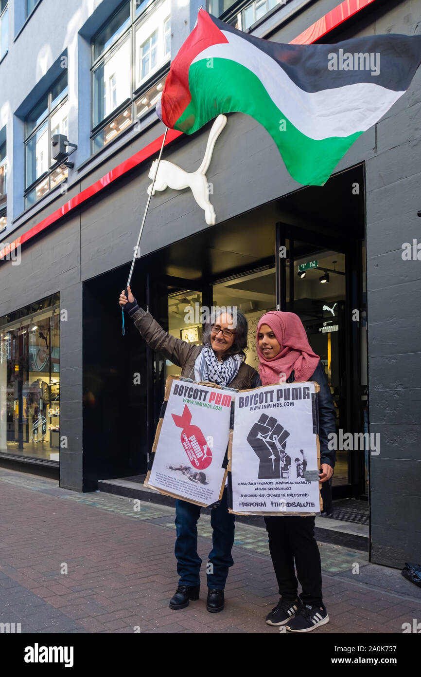 London, UK. 20th September 2019. Inminds Islamic human rights group protest outside Puma in Carnaby St calling for a boycott of Puma products. They say Puma whitewashed Israel's war crimes by sponsoring the apartheid Israel Football Association which includes clubs from illegal settlements built on stolen Palestinian land  which is a war crime under international law, 215 Palestinian sports clubs asked Puma to respect human rights and cut its ties with the IFA. Peter Marshall/Alamy Live News Stock Photo