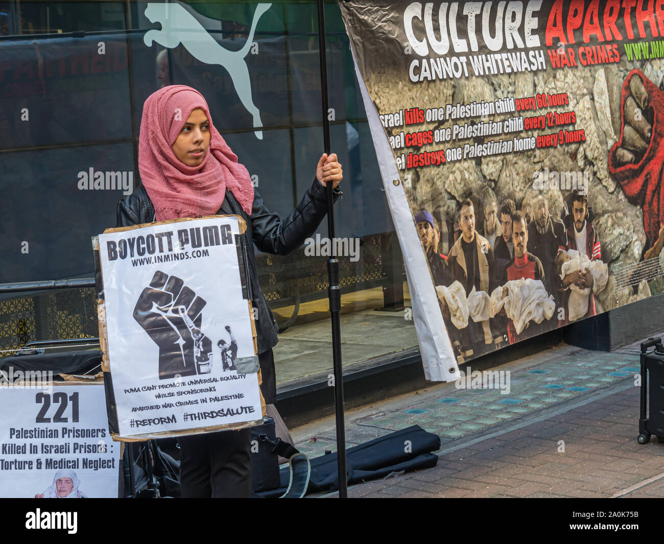 London, UK. 20th September 2019. Inminds Islamic human rights group protest outside Puma in Carnaby St calling for a boycott of Puma products. They say Puma whitewashed Israel's war crimes by sponsoring the apartheid Israel Football Association which includes clubs from illegal settlements built on stolen Palestinian land  which is a war crime under international law, 215 Palestinian sports clubs asked Puma to respect human rights and cut its ties with the IFA. Peter Marshall/Alamy Live News Stock Photo