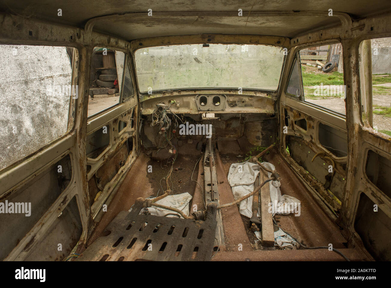 Interior of wrecked car inside an abandoned factory in Brazil Stock Photo