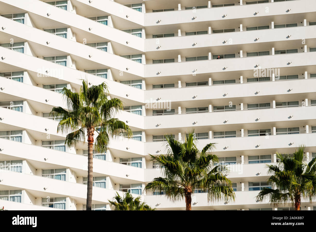 facade  hotel or apartment building palm trees - Stock Photo