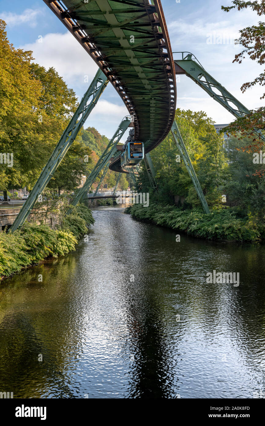 The amazing hanging monorail called the Schwebebahn in Wuppertal, near Dusseldorf in Western Germany. All trains are now this pale blue colour. Stock Photo