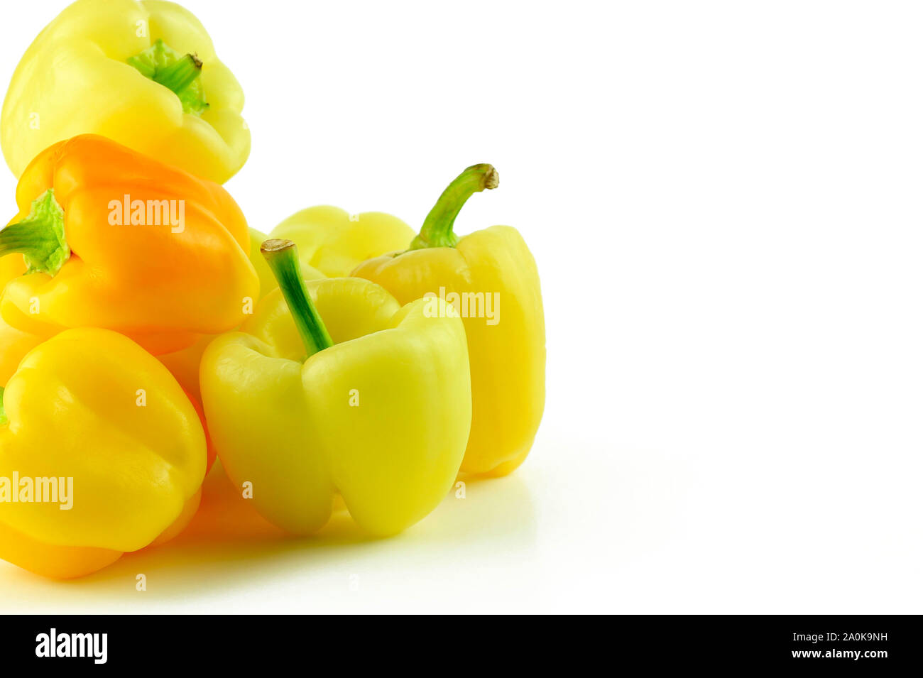 Yellow peppers isolated on white background Stock Photo - Alamy