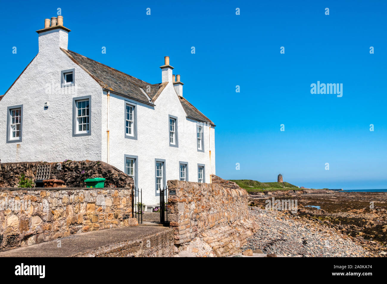 St Monan's in the East Neuk of Fife with St Monans Windmill in the background. Stock Photo