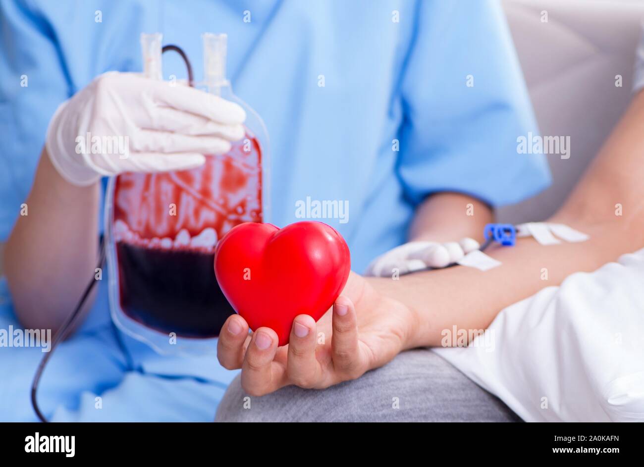The patient getting blood transfusion in hospital clinic Stock Photo