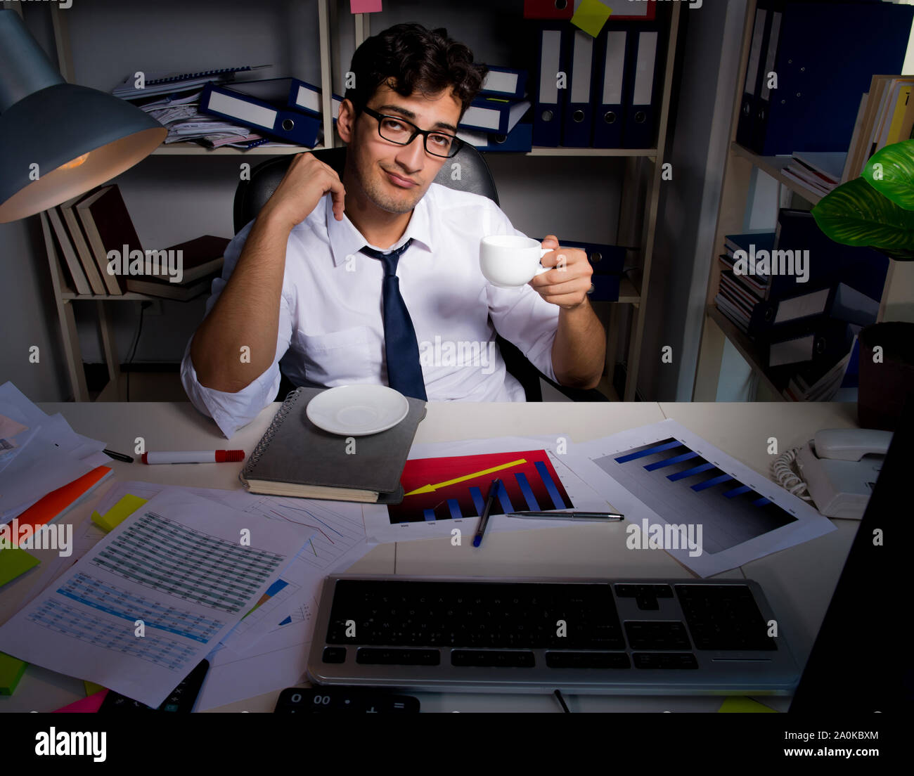 The man businessman working late hours in the office Stock Photo Alamy