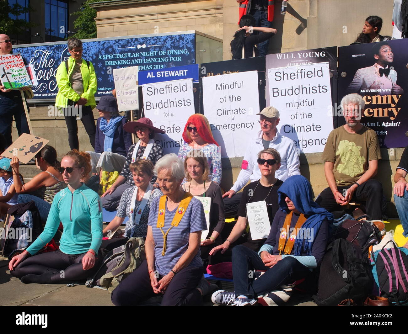Group of Sheffield Buddhists meditating during Global Climate Strike protest at Sheffield City Hall 20th September 2019. Stock Photo