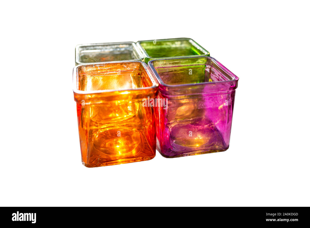 Colored glass coasters for tealights, side view, isolated on a white
