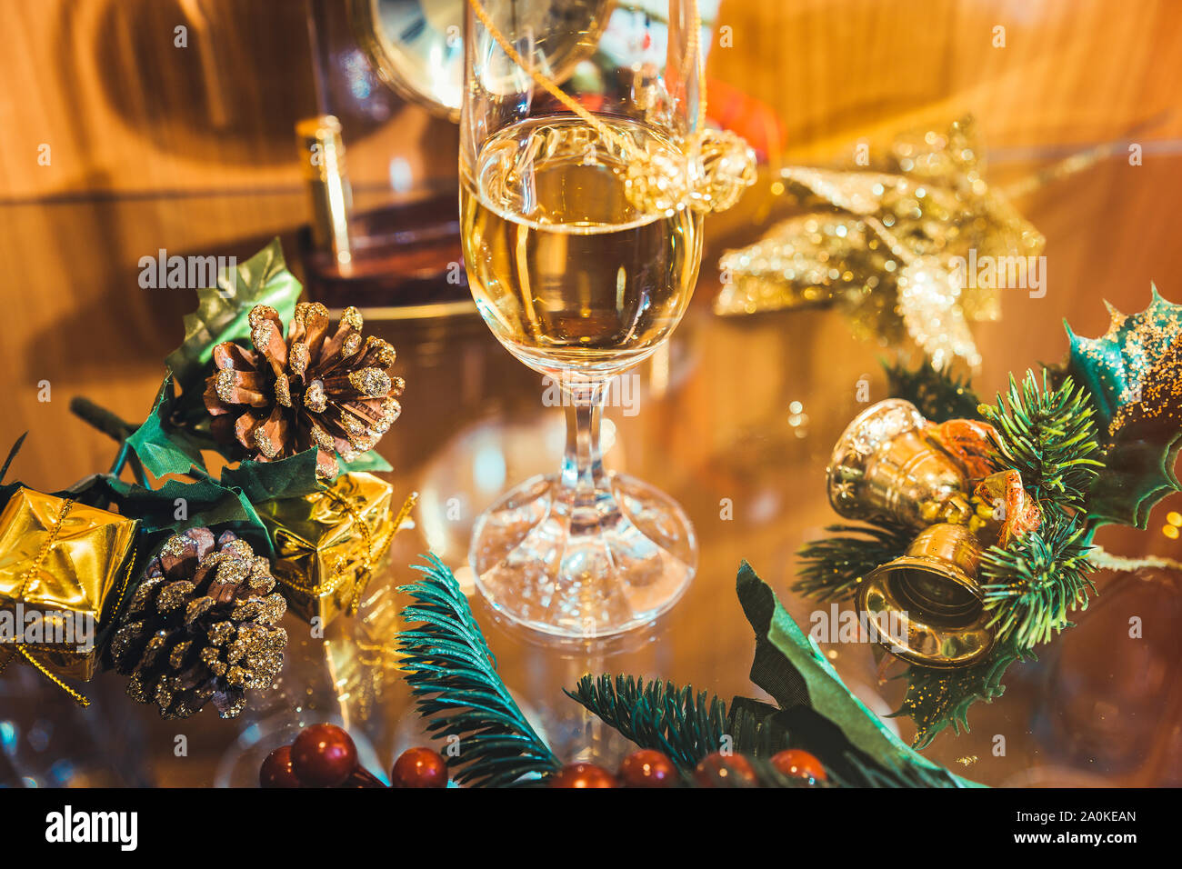 Christmas background with champagne glass and golden christmas decorations Stock Photo