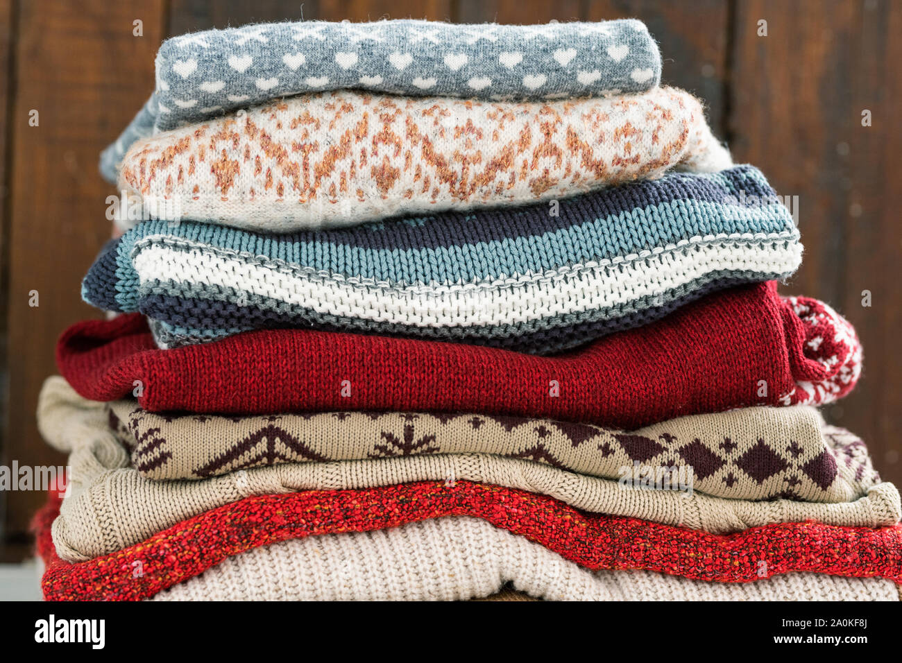 Warm cotton and woolen sweaters on top of each other prepared for cold season Stock Photo