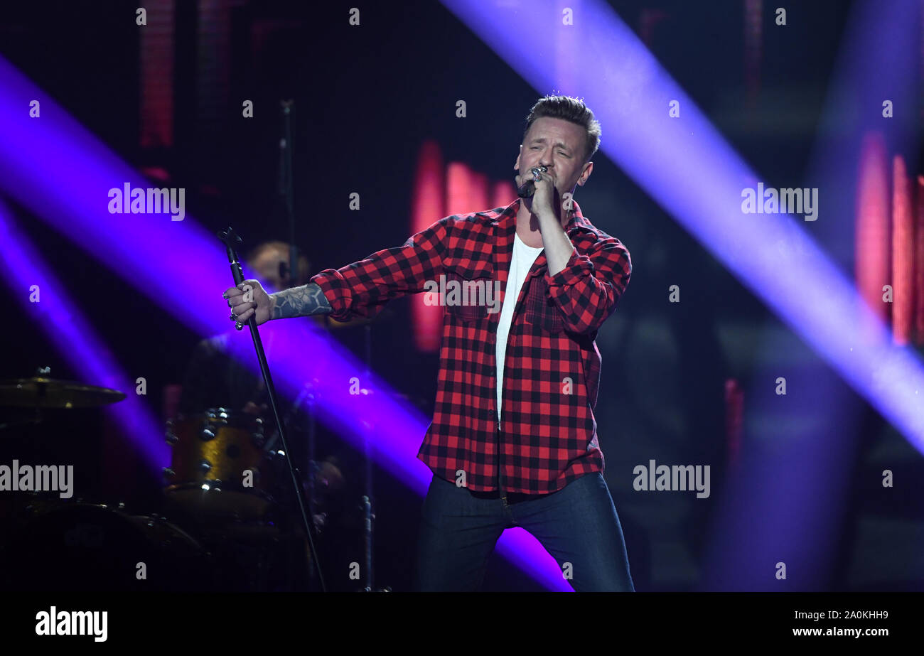 Leipzig, Germany. 20th Sep, 2019. The singer Ben Zucker sings during the television gala 'Goldene Henne' on stage. A total of 53 nominees from show business, society and sport can hope for the award. The Golden Hen is dedicated to the GDR entertainer Hahnemann, who died in 1991. Credit: Hendrik Schmidt/dpa-Zentralbild/dpa/Alamy Live News Stock Photo