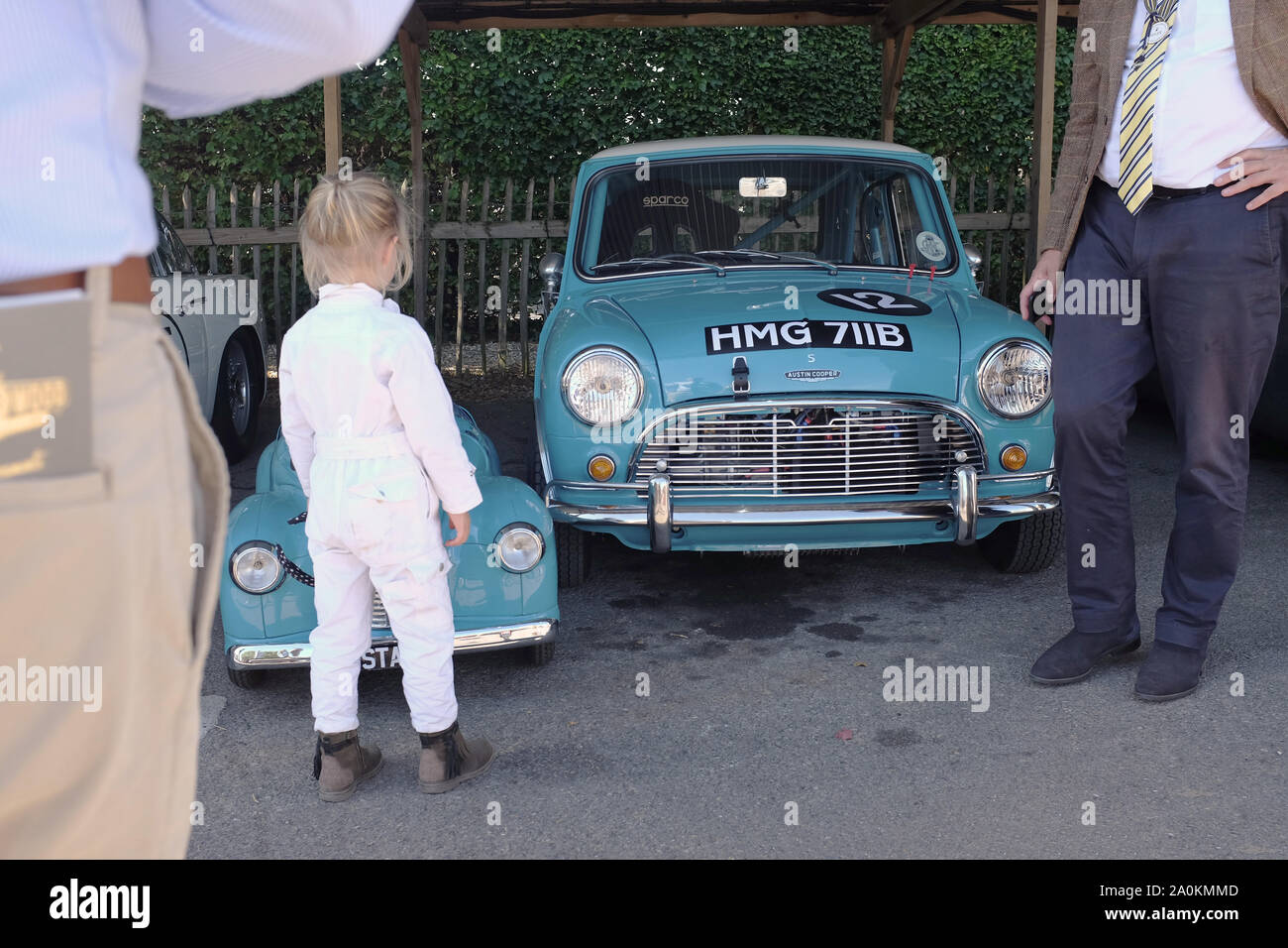 September 2019 - Austin Mini Cooper S and Austin J40 with young driver, cars in matching blue colours in the paddock at the Goodwood revival meeting Stock Photo
