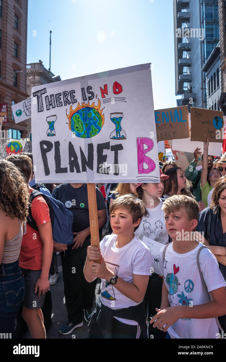 San Francisco, USA. 20th September, 2019. Student Strike for Climate march, one of many global climate strikes on this day around the world. Boys stand together holding a sign reading, 'There is no planet B.' Credit: Shelly Rivoli Stock Photo