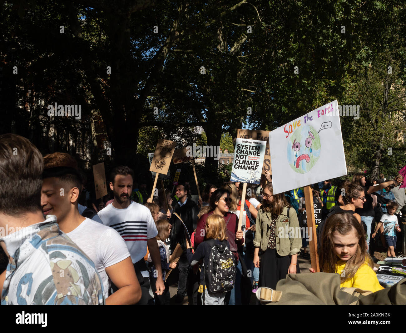 LONDON, UK - SEPTEMBER 20 2019: Crowd of people at the Global Climate Strike in London, holding placards Stock Photo