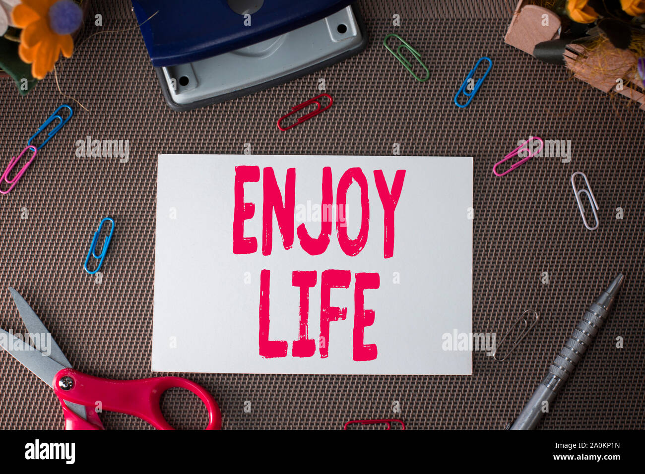 Handwriting text Enjoy Life. Conceptual photo Any thing, place,food or demonstrating, that makes you relax and happy Scissors and writing equipments p Stock Photo