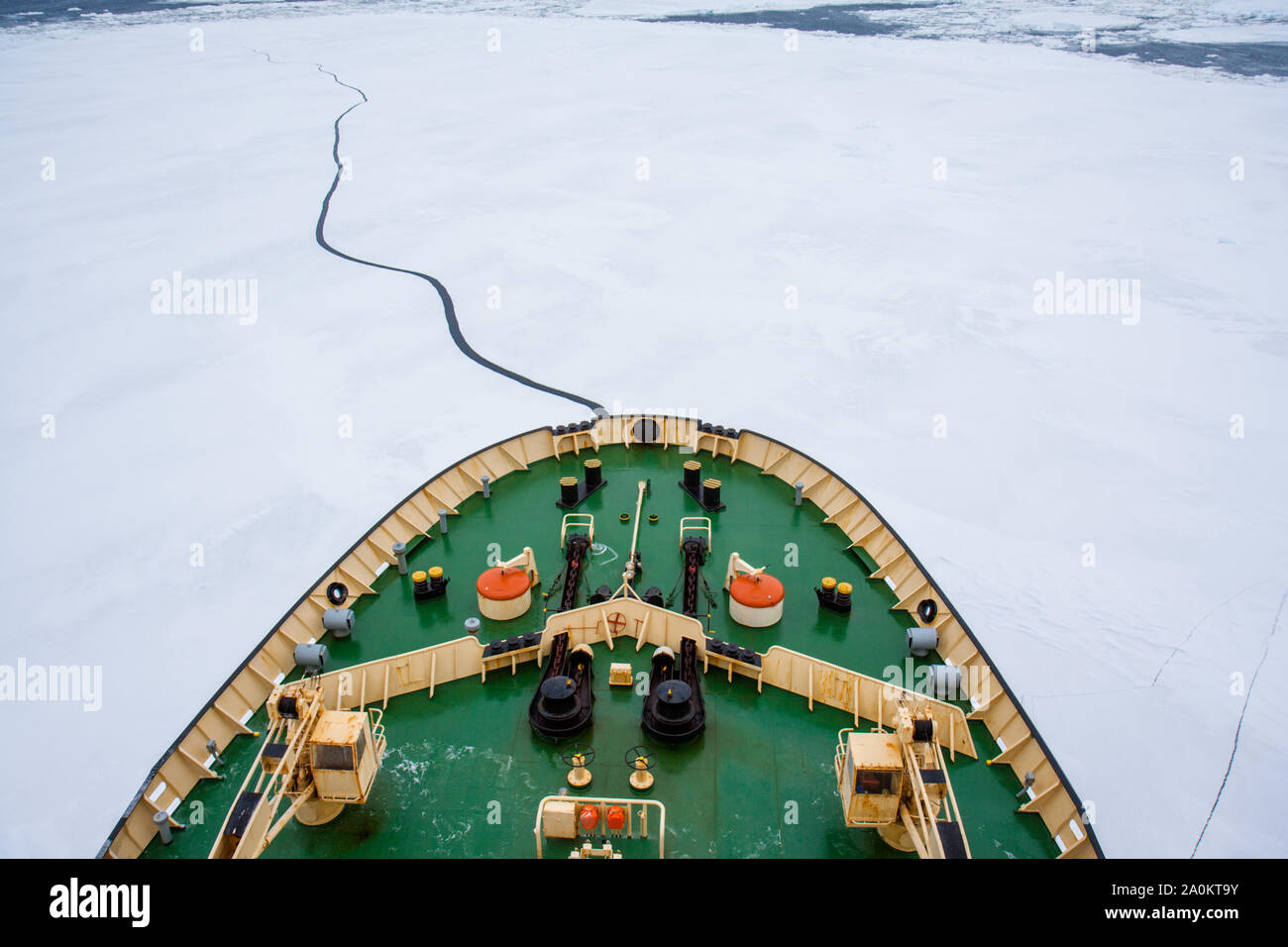 Prow of the Icebreaker Kapitan Khlebnikov cutting through sea ice and floes en route to the Weddell Sea, Antarctica Stock Photo