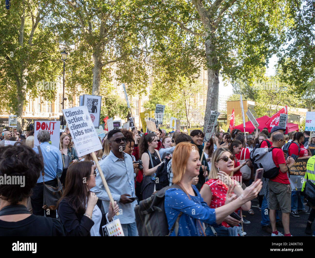 LONDON, UK - SEPTEMBER 20 2019: Crowd of people at the Global Climate Strike in London, holding placards Stock Photo