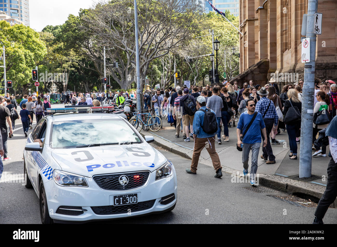 Sydney, police car drives between protestors at the Sydney climate change strike rally,nsw,Australia Stock Photo