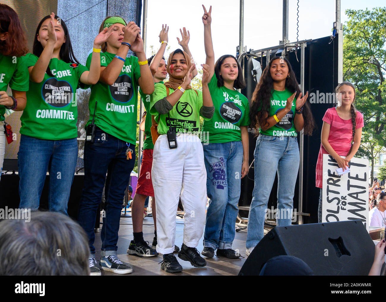 New York, USA,  20 September 2019.  Swedish activist Greta Thunberg shyly stays at the edge of the stage along with fellow organizers after addressing a Climate Strike rally in New York City.  Credit: Enrique Shore/Alamy Live News Stock Photo