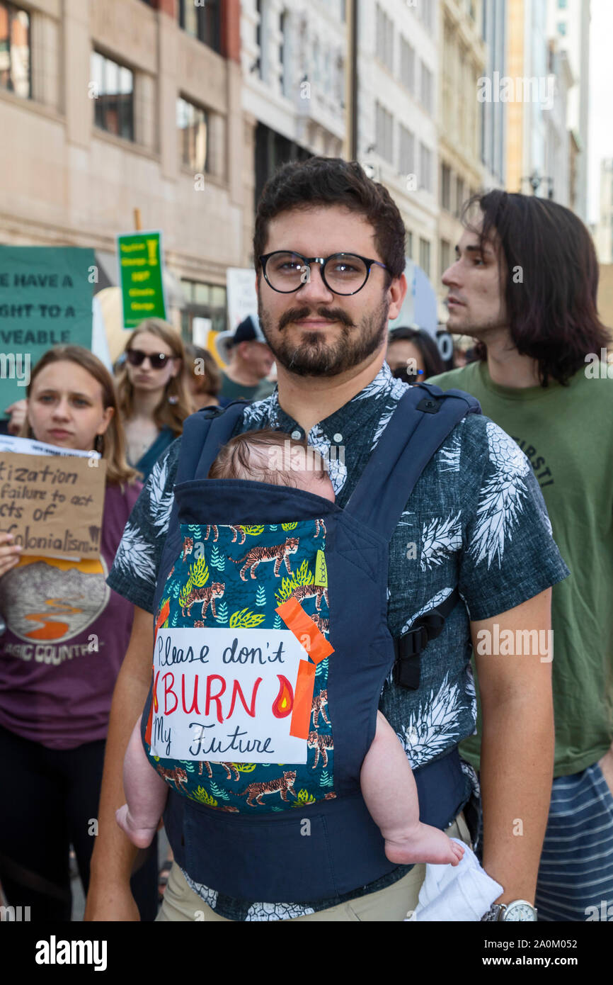 Detroit, Michigan, USA - 20 September 2019 - Derek Shaffer carried his son, Noah, 3 months, during the Global Climate Strike. It was part of a movement in more than 175 countries to end the age of fossil fuels. Credit: Jim West/Alamy Live News Stock Photo