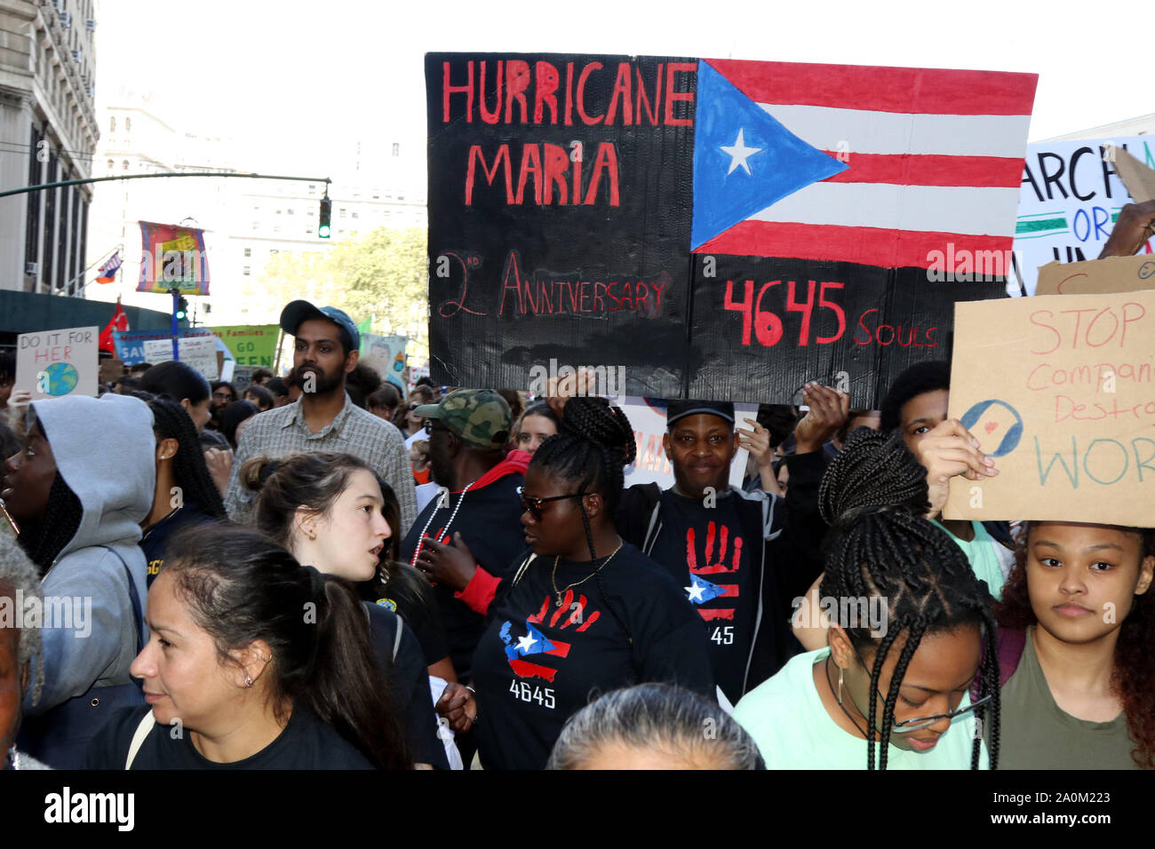 New York City, New York, USA. 20th Sep, 2019. Puerto Ricans in New York City, joined the Global Strike March in New York City on 20 Sep, 2019, in memory of the four (4) thousand plus lives lost on the second (2nd.) anniversary of hurricane Maria's devastation of the island, which struck the Caribbean-US territory on 20 Sep, 2018, and who are still struggling with recovery from the climate induced disaster. Credit: G. Ronald Lopez/ZUMA Wire/Alamy Live News Stock Photo