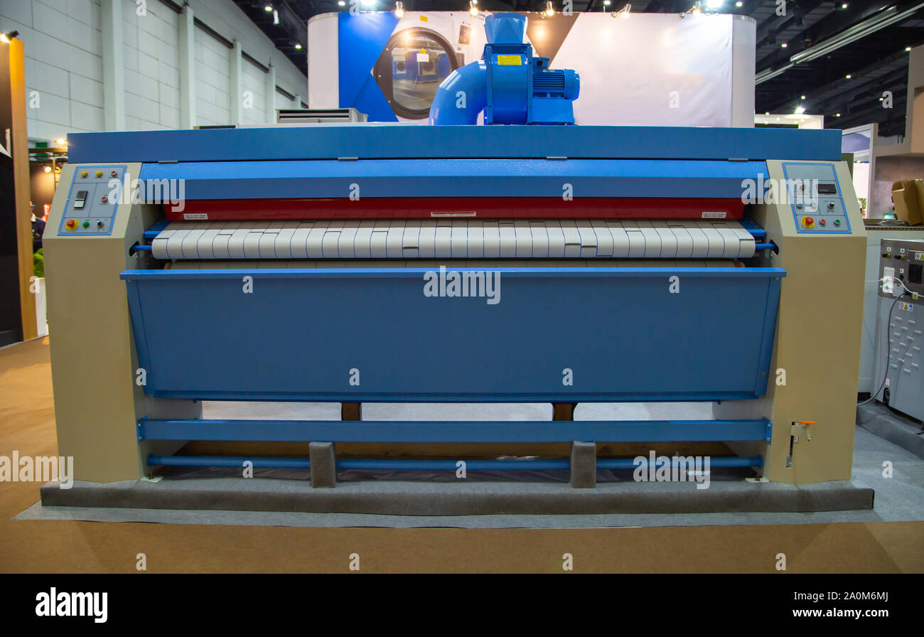 Commercial bed sheet laundry ironer flatwork equipment Stock Photo Alamy