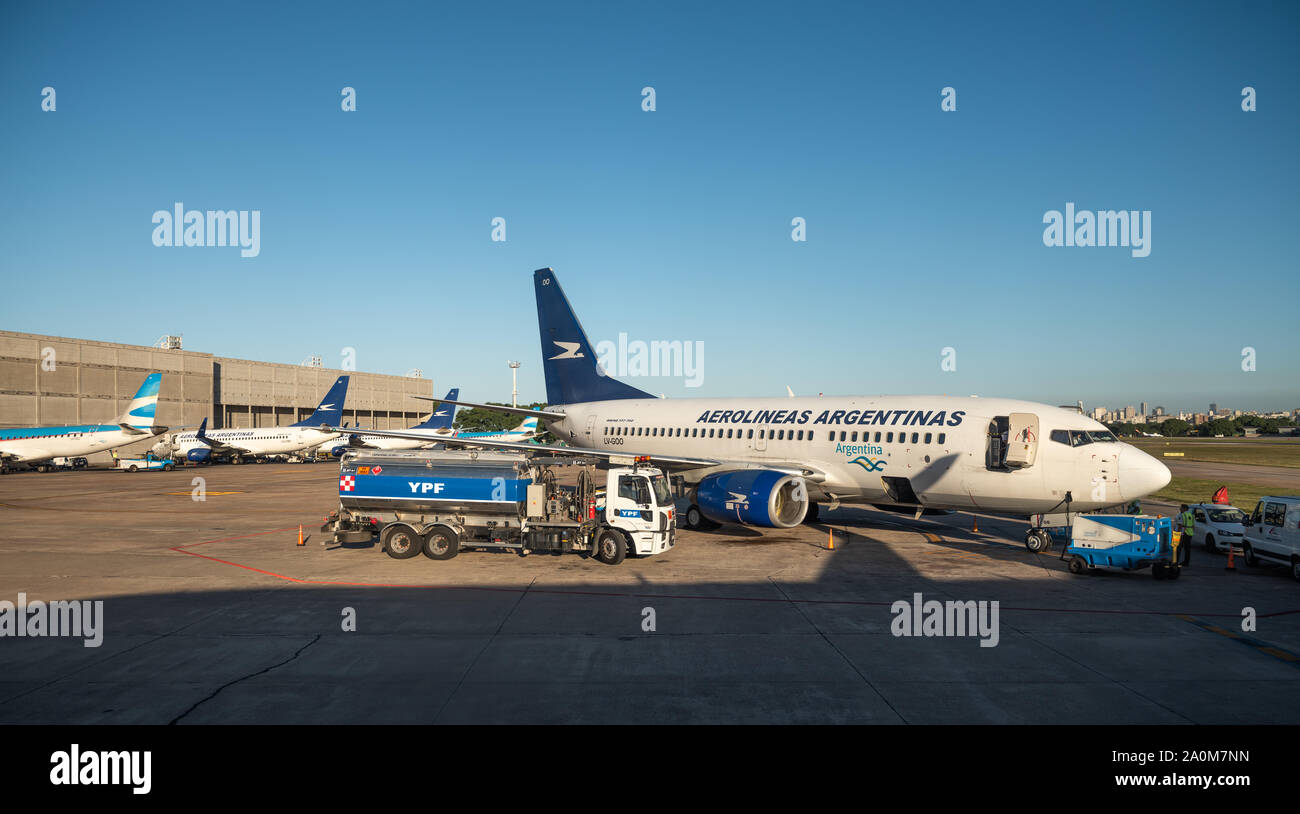 Buenos Aires, Argentina - April 3 2019:  Commercial airplane of Aerolineas Argentinas recharging fuel for a domestic flight in the local airport Stock Photo