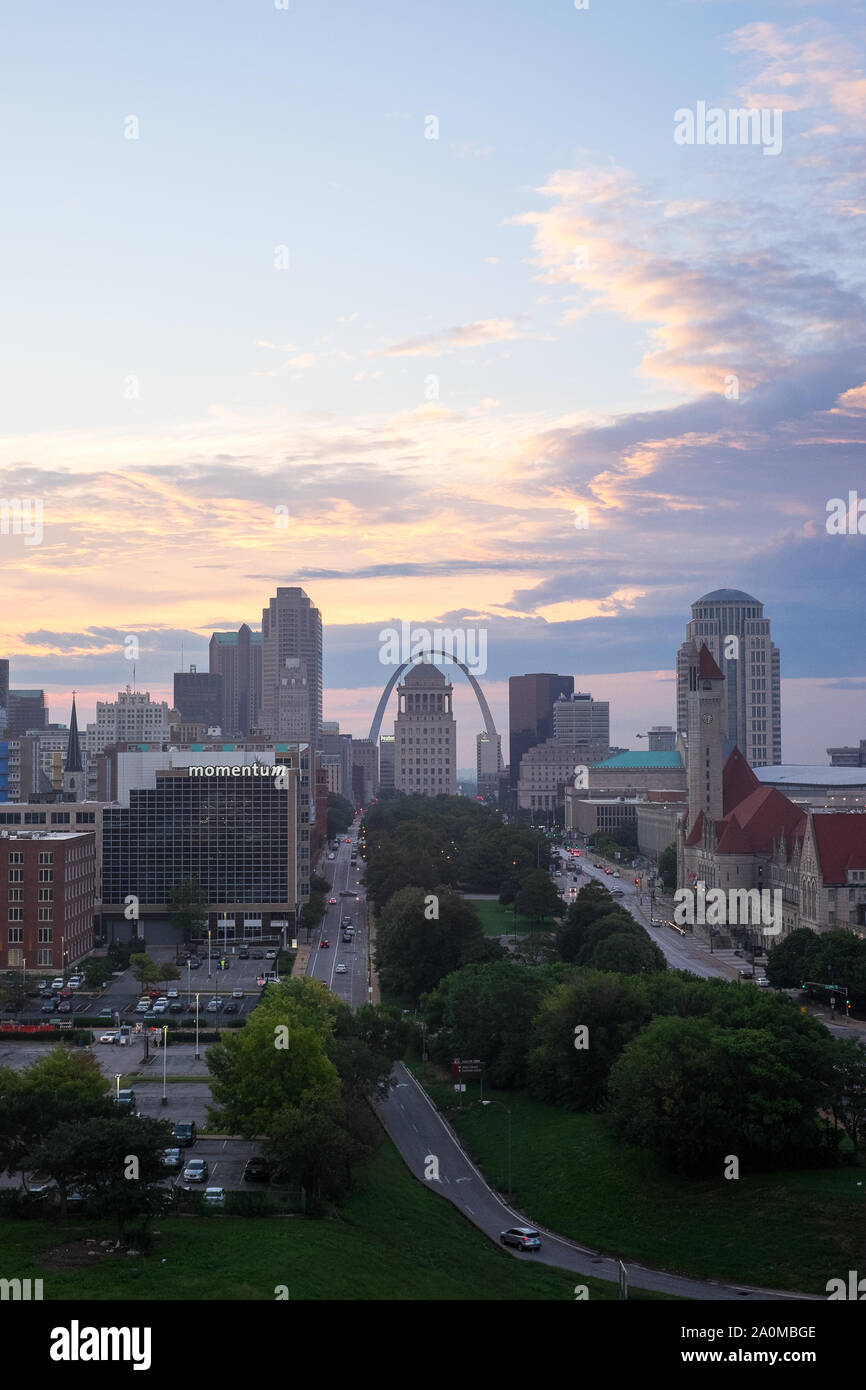 Just before sunrise, clouds roll over the St. Louis, MO skyline, featuring the iconic Gateway Arch. Stock Photo